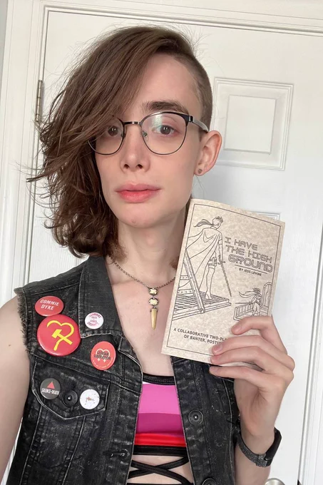 me with a copy of IHtHG and a lesbian pride flag top