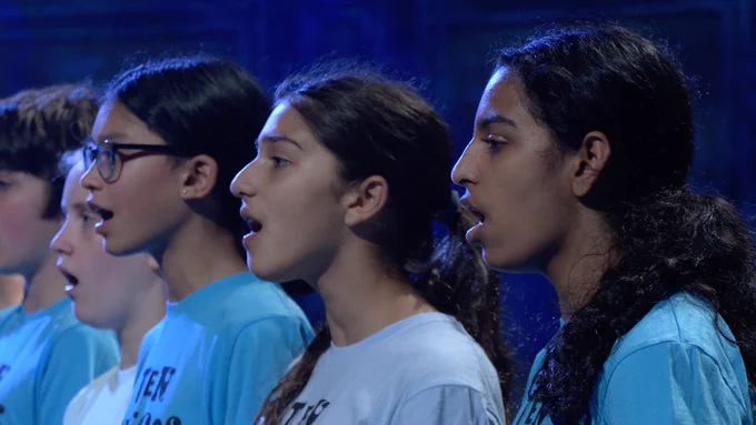 A children’s choir singing