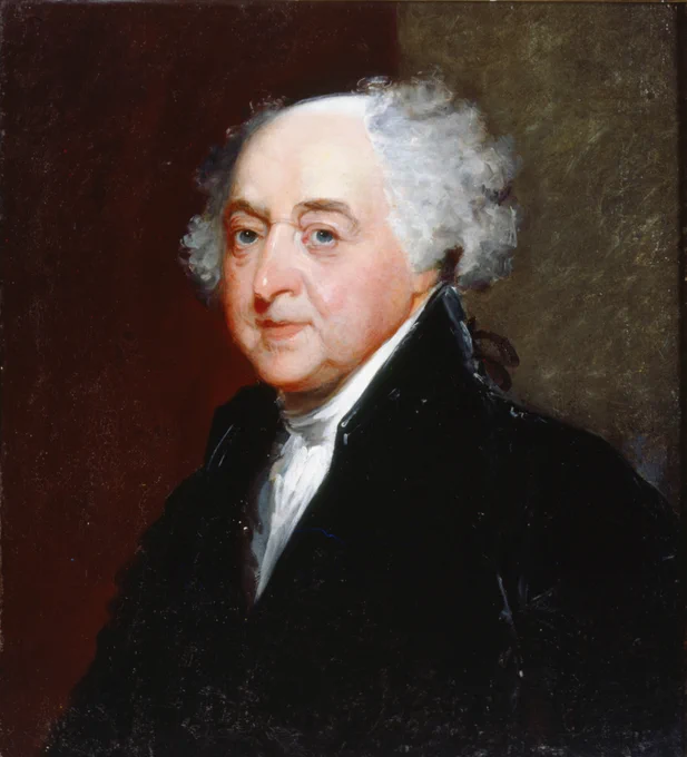 Color photograph of a painting of an old white man with white hair, balding on top. He wears a black jacket and vest with a white cravat. He looks at the viewer. The background is red on the left and brown on the right. 
