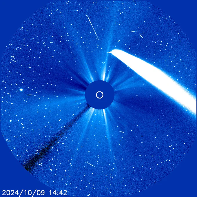 Coronagraph image with the Sun (blocked out) in the centre, and Comet C/2023 A3 appearing as a bright white streak on the right