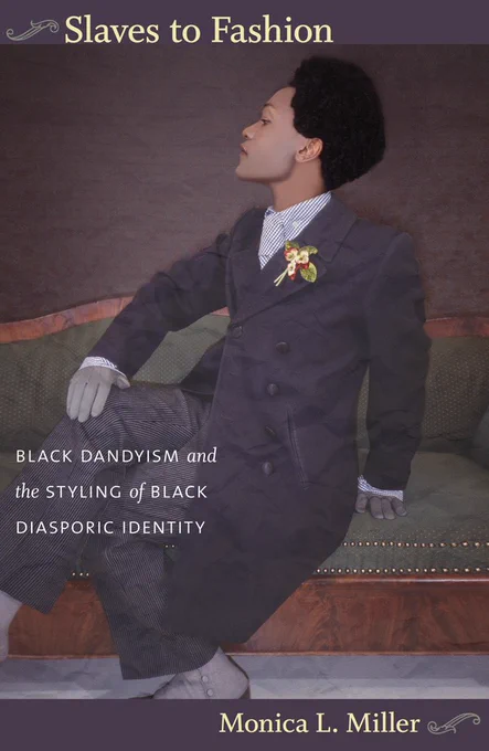 Cover of Slaves to Fashion: Black Dandyism and the Styling of Black Diasporic Identity by Monica L. Miller. The title is in yellow at the top, with a curlicue to its left. The cover features detail from the painting "Yellow Book" by Iké Udé, with a light-skinned Black man in profile, sitting on chaise longue. He is wearing a dapper grey suit, gloves, and a floral boutonniere. The subtitle is written in white across his knees and the author's name is in yellow at the bottom of the cover.