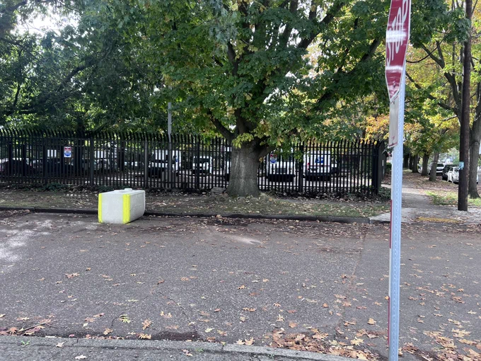 Concrete block in the parking zone in a street