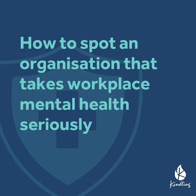 "How to spot an organisation that takes workplace mental health seriously" reads light blue text on a dark blue background, in front of a semi-transparent shield icon with a cross in the centre. In the bottom right corner of the graphic is the Kindling Interventions logo.