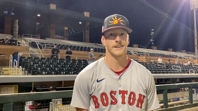 Danny Kirwin wearing the Boston Red Sox road uniform and Mesa Solar Sox cap