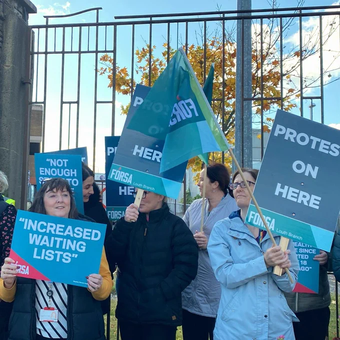 Forsa members in Drogheda holding placards with quotes saying increased waiting lists and protest on gere