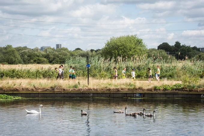 Children litter picking next to the canal