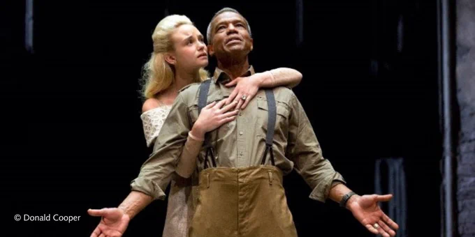 Photograph of  actors Joanna Vanderham and Hugh Quarshie in Othello, 2015. 
