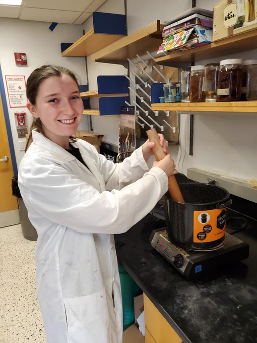 Student stirring a dye bath