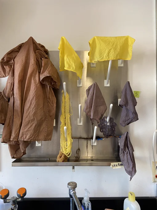 dyed textiles hanging in lab