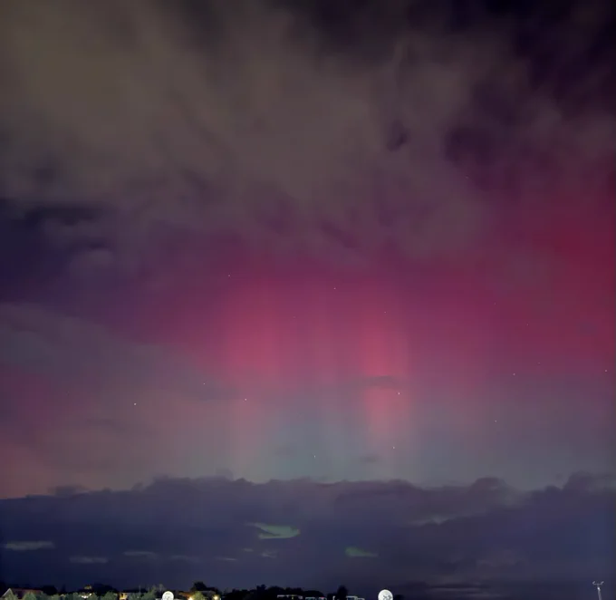 An image of the aurora with partly cloudy skies at Met Office HQ in Exeter.