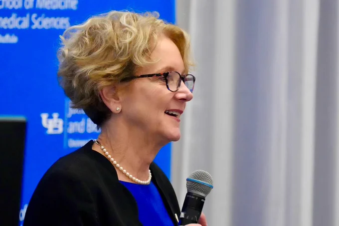 Dr. Brashear speaks at a podium