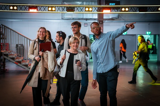 Colorintech co-founder Ashley Ainsley shows Minister Jones around Black Tech Fest 