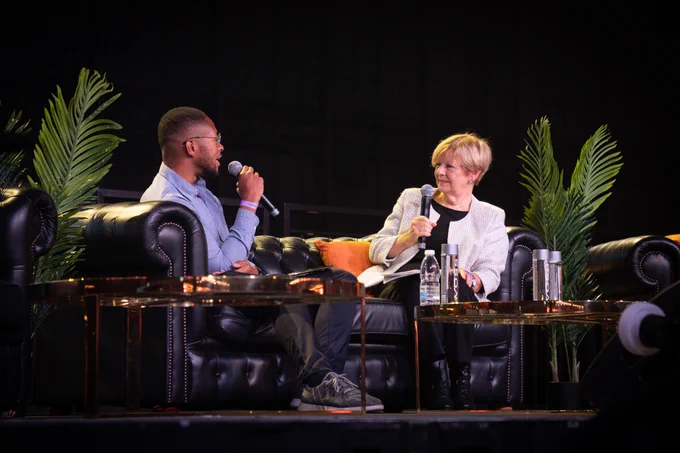 Minister Jones and Ashley Ainsley in a discussion on a sofa at Black Tech Fest