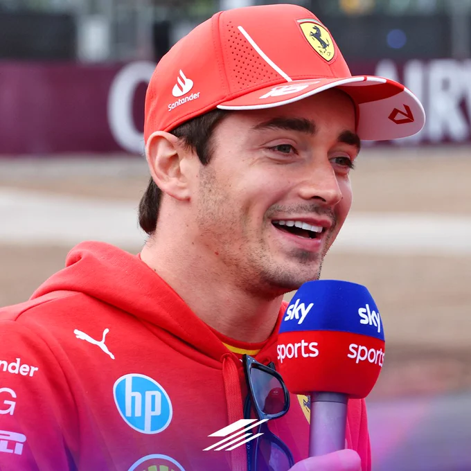 Charles Leclerc smiling while taking part in the Sky F1 Show at Silverstone