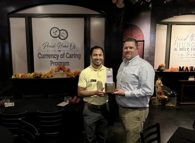 TREKK's Ryan Fleming (left) and Mike Brown (right) with the inaugural Currency of Caring Bags Tournament trophy.