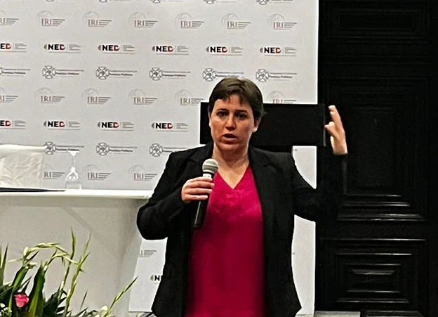 Keough School professor Laura Gamboa,  a democracy expert, is pictured speaking during a recent presentation in Guatemala.