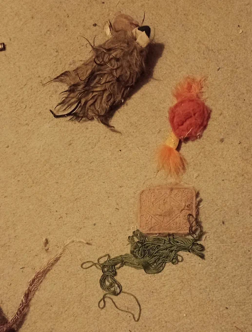 A few cat toys and a hank of embroidery yarn