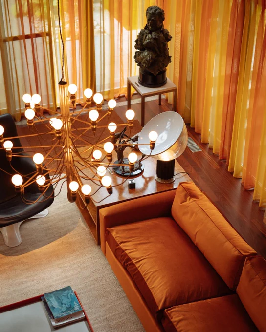 Shot taken above looking fish at orange shade and chandelier