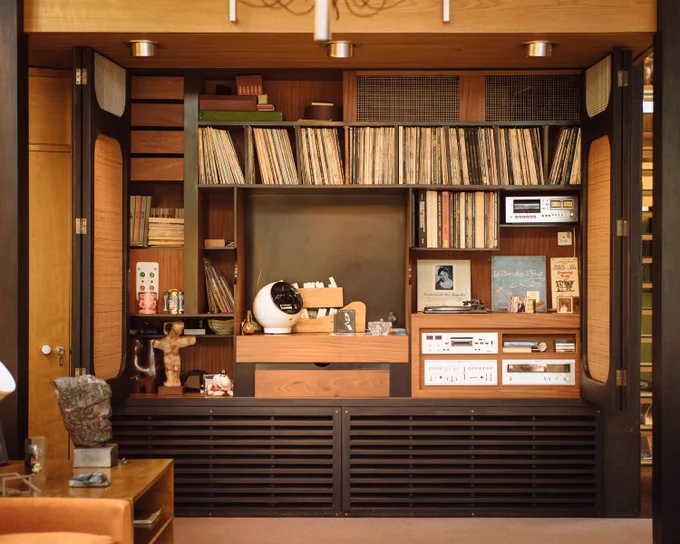 View of hidden cupboard filled with records
