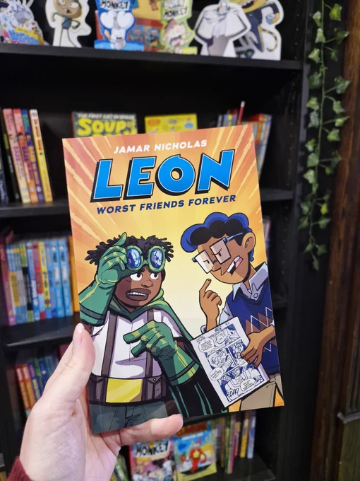 Photo of Leon Worst Friends Forever being held up in Wonderland Bookshop. 