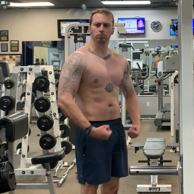 William Planer flexing with his shirt off at Access Total Fitness in Elizabeth