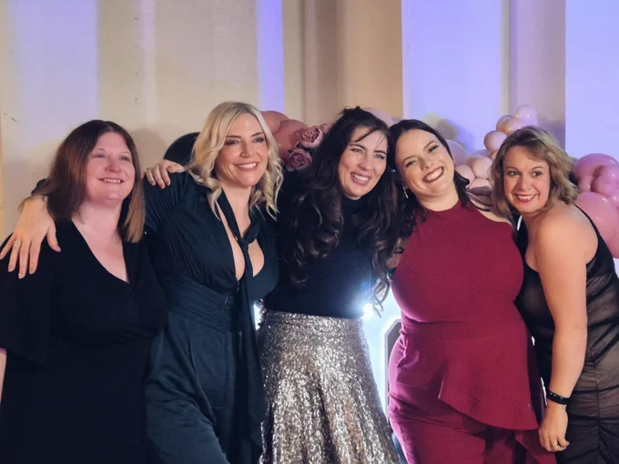 5 females smiling