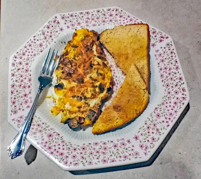 Sunday brunch was a 🥓🥓bacon cheeseburger omelet. I found a leftover hamburger patty in the fridge and thought, "Why not?"
It was delicious with some whole wheat toast and 🍓🍓Strawberry jelly. 
Eggs, bacon, burger patty,🧀🧀 grated cheddar cheese, and sauteed onions. Yum, yum!
https://www.newhampshiremainerealestate.com/