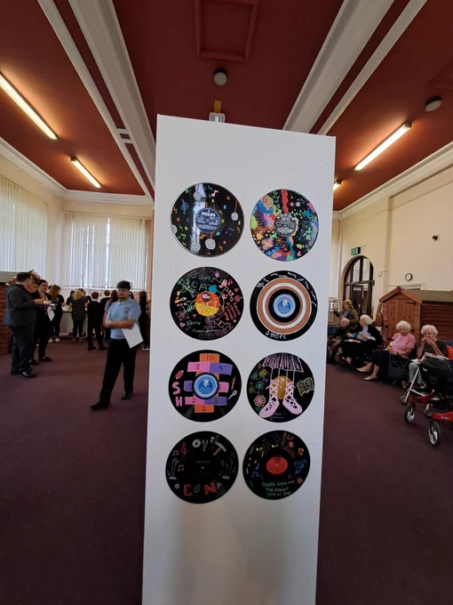 Colour photograph showing some of the intergenerational artwork created by pupils and residents in care homes