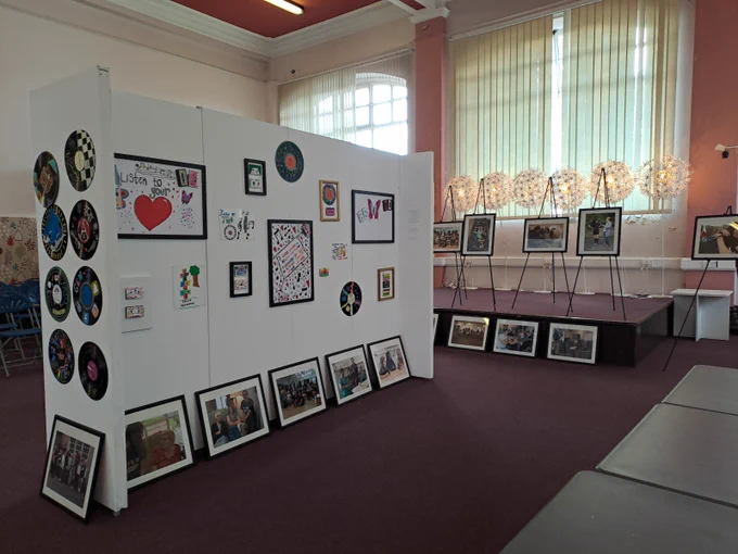 Colour photograph showing more of the intergenerational artwork and photographs.
