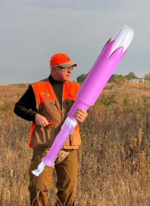 Gov. Tim Walk holding a giant tampon