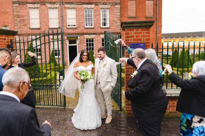 Jessi Bhatia and Michael Johnson leave Wolverhampton City Archives as husband and wife.