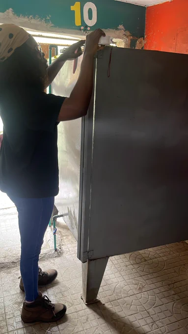 Tech expert inspecting a regular shaped 2000L Capacity tank.