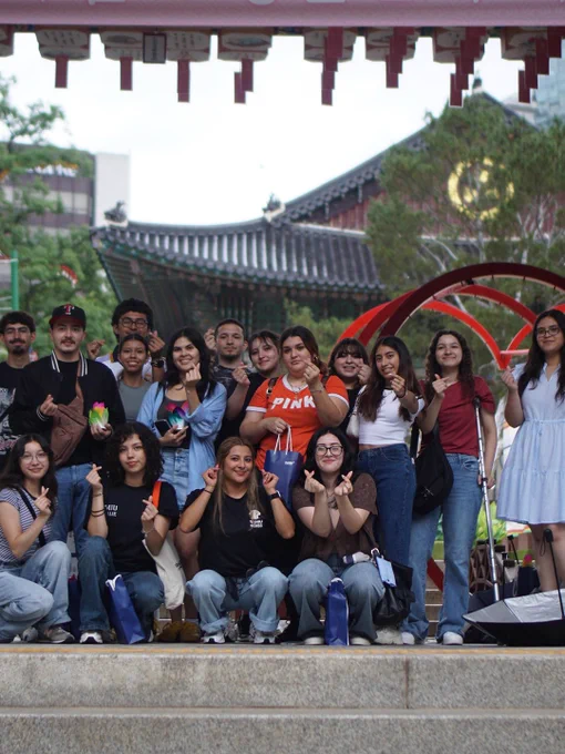 A group of students smile for the camera during a study abroad trip.