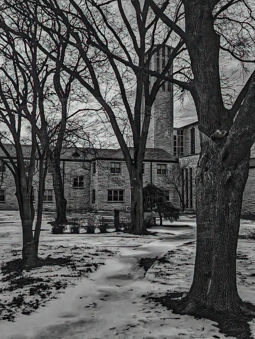 Black and white photo of the Abby Church in the winter 
