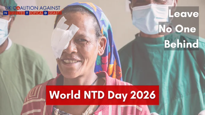 A smiling woman wearing a headscarf with a bandage over one eye stands in the foreground, with two healthcare workers in surgical gowns and masks behind her. Text on the image reads ‘Leave No One Behind’ and ‘World NTD Day 2026,’ alongside the logo of the UK Coalition Against Neglected Tropical Diseases.