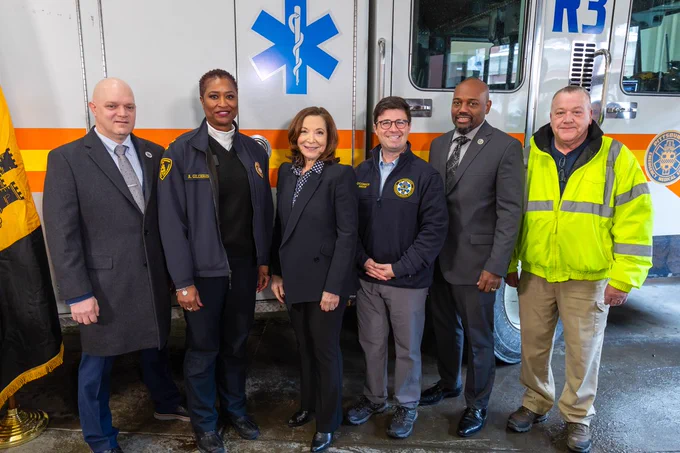 (from left to right) Jonathan Atkinson, president of the Fraternal Association of Professional Paramedics Local 1; Amera A. Gilchrist, Pittsburgh EMS chief; Leslie Davis, president and CEO of UPMC; Corey O’Connor, Pittsburgh mayor; Sheldon Williams, Pittsburgh’s acting public safety director; and John McClory, Pittsburgh’s acting public works director pose for a photo in front of Medic 3, a 31-year-old rescue truck that has driven over 100,000 miles.