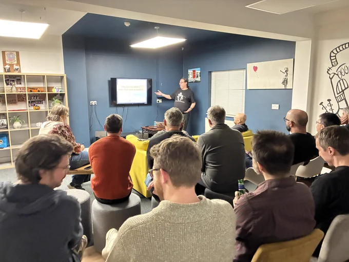 Tom presenting, view from back of audience