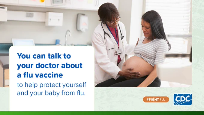 A healthcare provider and a pregnant woman in a clinical setting. 

Overlay text reads “You can talk to your doctor about a flu vaccine to help protect yourself and your baby from flu.” The hashtag Fight Flu and CDC logos are on the bottom.
