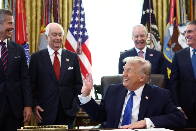 Reuters image of President Donald Trump signing IndyCar race executive order.