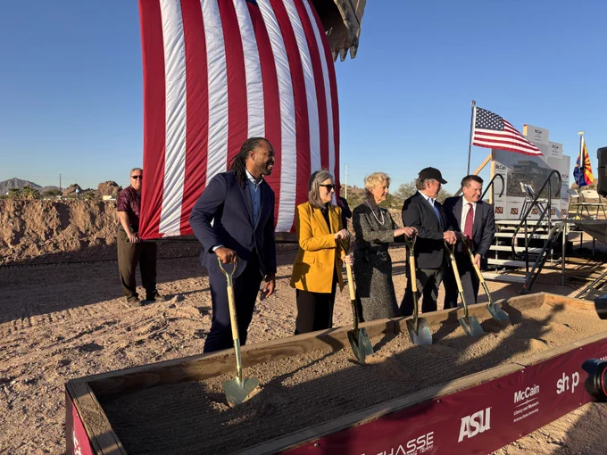Arizona leaders dig shovels into the ground during a ceremony for the McCain Library and Museum in Tempe.
