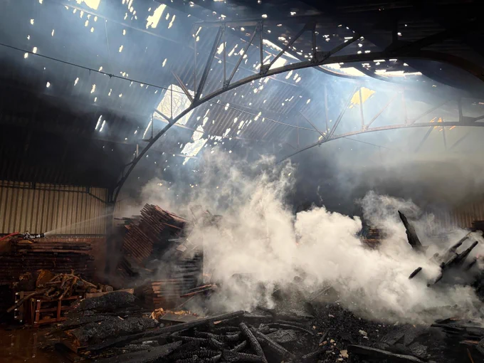 Barn with smoke and gaps in roof