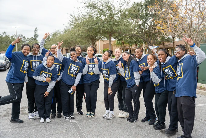 Group of SPC students posing and wearing shirts that read "MLK Day of Service."