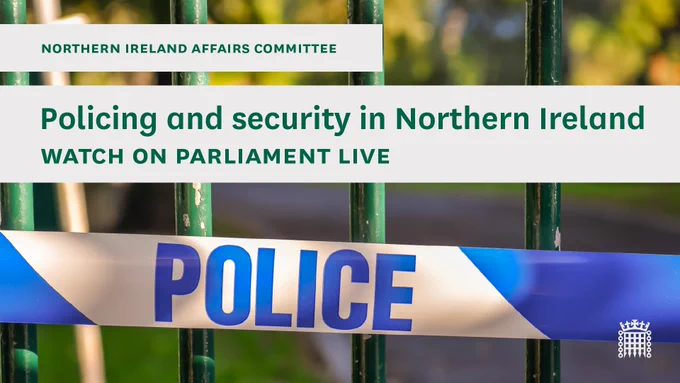 Northern Ireland Affairs Committee.
Policing and security in Northern Ireland.
Watch on Parliament Live.
Photo shows a police blue and white striped plastic tape, with the name police on it stretched across a green metal fence.