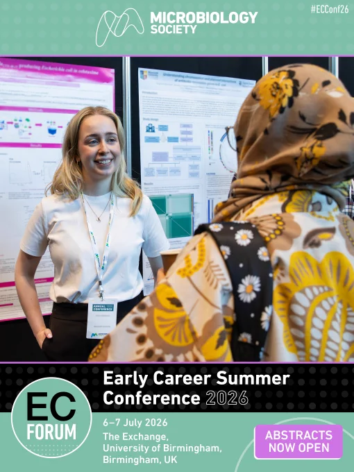 Two people engaged in discussion at a poster session during the Early Career Summer Conference 2025.