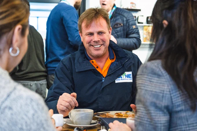 Man smiling at the Big Breckland Breakfast.