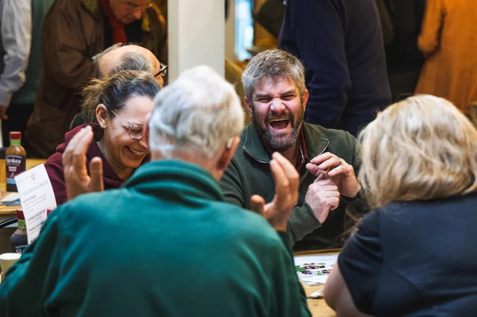 People laughing at the Big Breckland Breakfast.