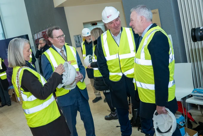Image shows four people talking together including Professor Sir Ian Greer, President and Vice-Chancellor of Queen's University Belfast and Lord Mayor of Belfast, Councillor Tracy Kelly.
