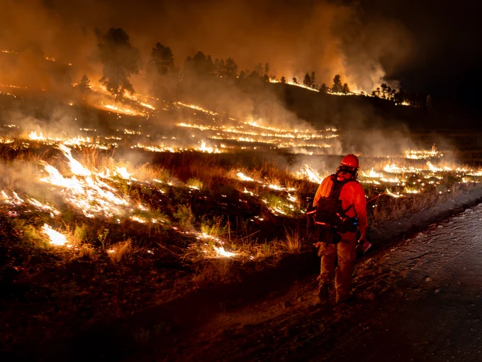 Wildland firefighter working night shift on a wildland fire. Photo by Paul Hensel on the Turkey Feather Fire. 