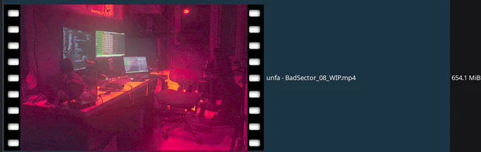 An image of my home studio, bathed in red light and smoke, with errors on multiple computer screens. It's a preview of a video file named "unfa- Bad Sector_08_WIP.mp4" that is 654.1 MBs in size.