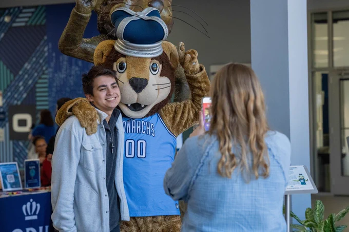 Student taking photo with Big Blue